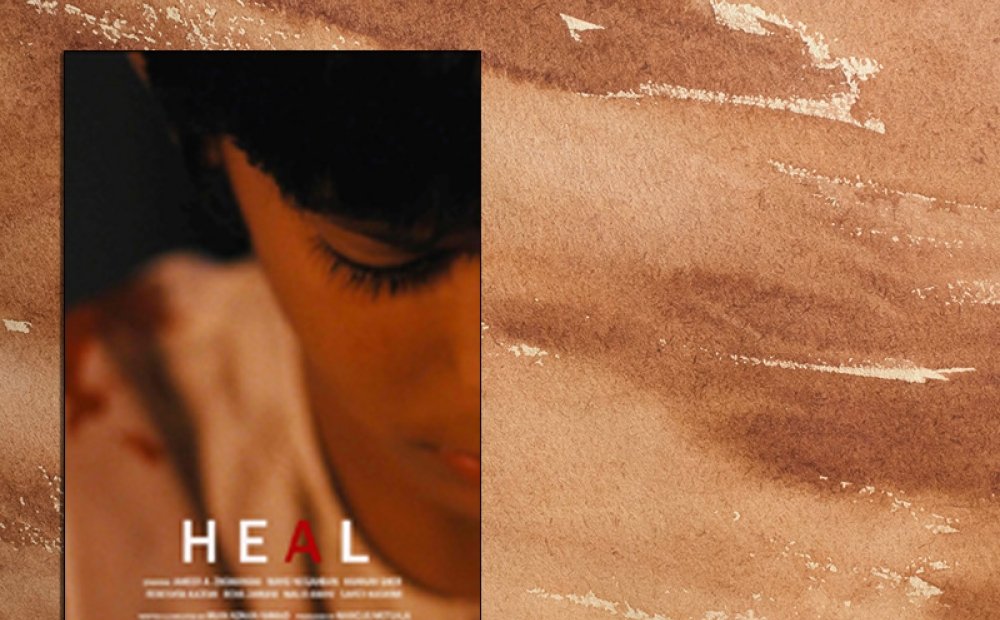 The poster of the film "Heal" which shows a close up shot of a young child.