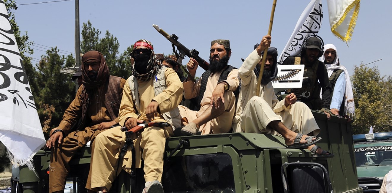 Taliban fighters celebrate the third anniversary of the withdrawal of US-led troops from Afghanistan, in Kabul, Afghanistan, Wednesday, Aug. 14, 2024. (AP Photo/Siddiqullah Alizai)