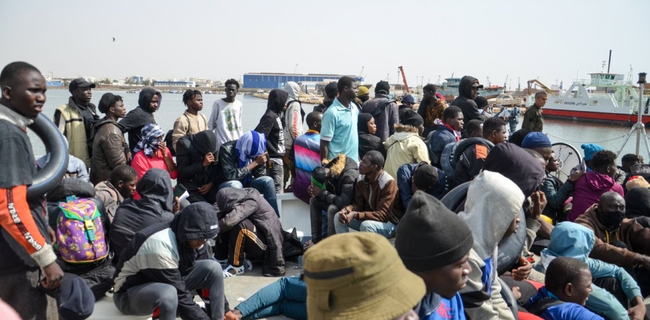 Group of migrants on a boat attempting to cross the Mediterranean