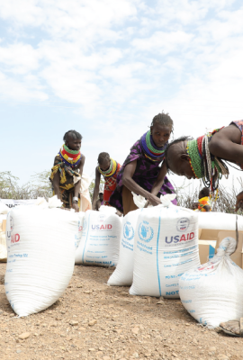 Locals assess the provisions given by USAID during Administrator Samantha Power's trip to East Africa.