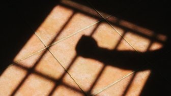 Shadow of a hand in prison