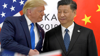 June 29, 2019, file photo, US President Donald Trump, left, shakes hands with Chinese President Xi Jinping during a meeting on the sidelines of the G-20 summit in Osaka, western Japan.