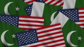 Flags from the U.S. and Pakistan overlapping each other.