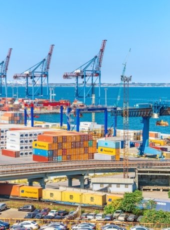 Color containers and cranes in the Odessa city port - the seaport of Ukraine on the Black Sea