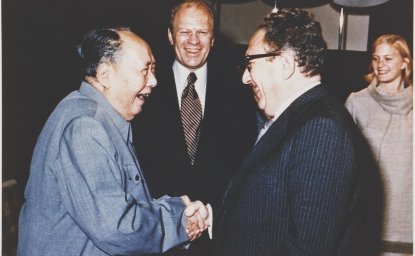 President Ford and daughter Susan watch as Secretary of State Henry Kissinger shakes hands with Mao Tse-Tung; Chairman of Chinese Communist Party, during a visit to the Chairman’s residence.  