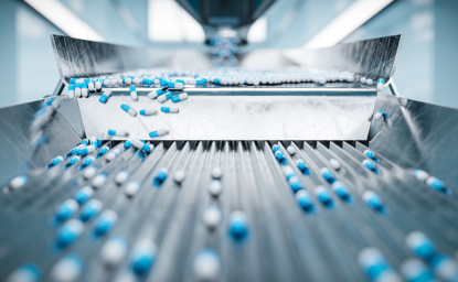 Pharmaceutical capsules on a conveyor belt