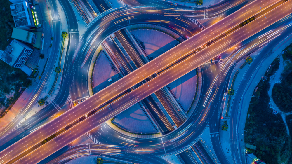Aerial shot of a roundabout interchange at night