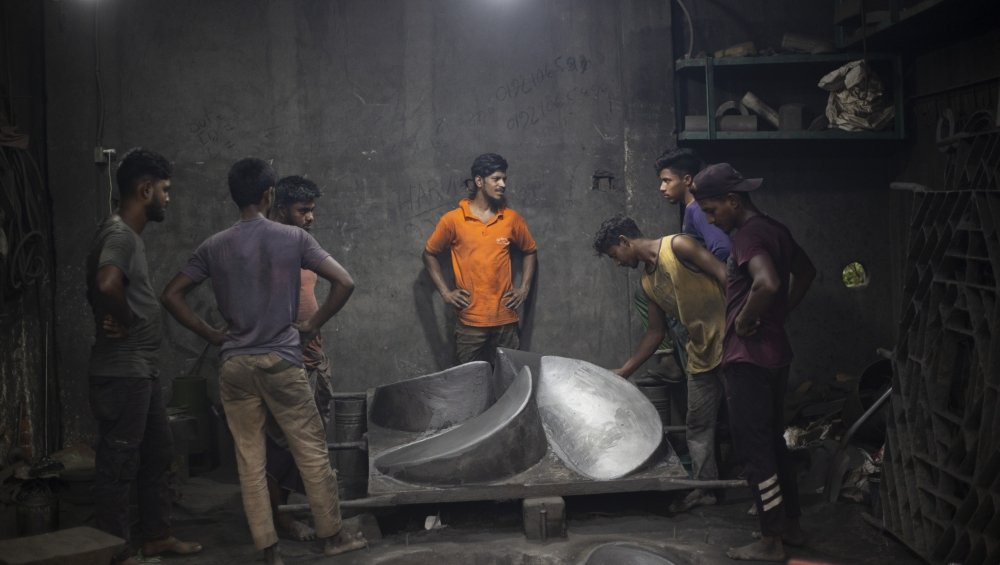 Young men in Dhaka's Buriganga river shipyards
