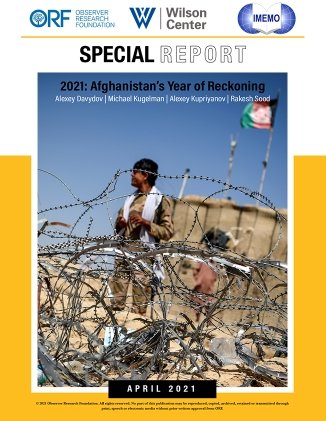 On the cover of the report is a picture of a man in a military uniform standing behind a barbed wire fence.