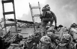 A soldier climbs over the seawall during the Inchon Landing in 1950.