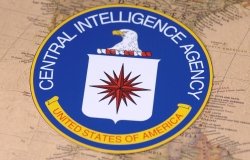 The seal of the CIA sitting on top of a map of North America