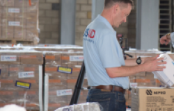 While in Cúcuta, Columbia, then USAID Administrator Mark A. Green takes a tour of the warehouse holding supplies. Photo from Ambassador Mark A. Green, used with permission.