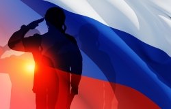 Silhouettes of Russian soldiers in uniforms on background of the Russian flag.