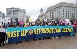 Participants in the annual Women’s March demand reproductive justice in Washington, DC
