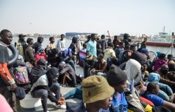 Group of migrants on a boat attempting to cross the Mediterranean
