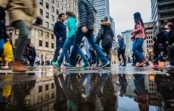 People walking fast during shipping hour on Ste-Catherine Street in Montreal, Canada